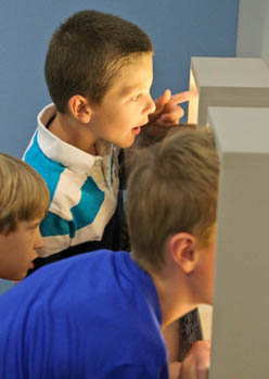 Panoply animations in Winnipeg Art Gallery Canada children look at Panoply animations in a museum