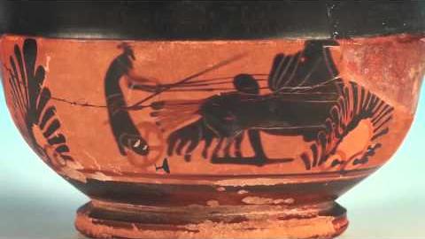 Vase showing a charioteer on a chariot with four horses.